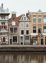 Pastel colored canal houses along the Spaarne in Haarlem | Fine art photo print | Netherlands, Europ by Sanne Dost thumbnail