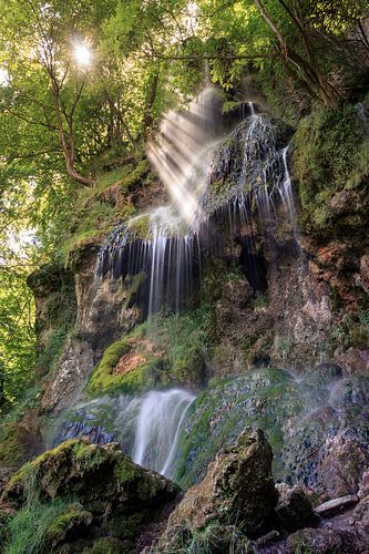 Rays of light at the Urach waterfall