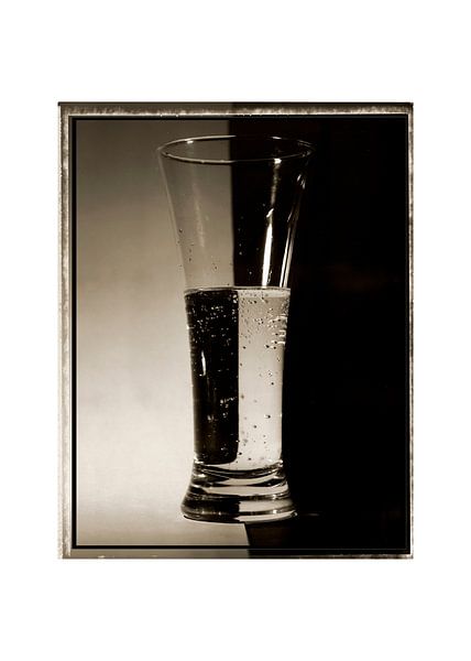 Glass filled with water by Jon Vismans