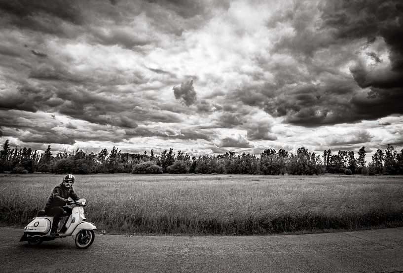 Scooter with dramatic sky by Roland Coenraets