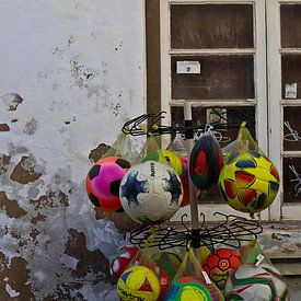 Balls at kiosk in the Algarve. by Marieke van der Hoek-Vijfvinkel