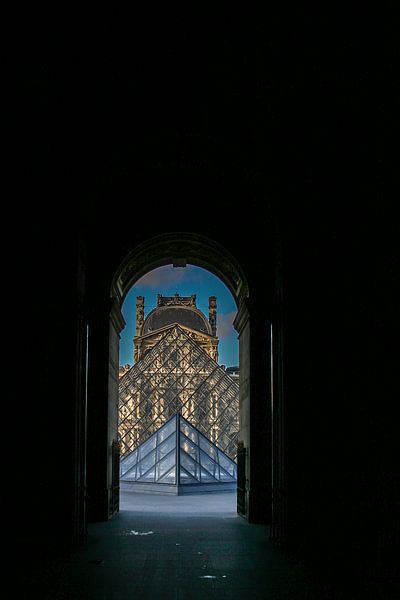 view through the glass pyramid of the louvre in paris by Eric van Nieuwland
