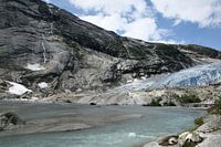 Glacier Nigardsbreen with  a lake of meltwater