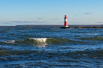 Waves and pier tower on the coast of the Baltic Sea in Warnemünde by Rico Ködder