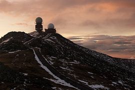 Radar buildings on the mountain top by Martijn Aleman