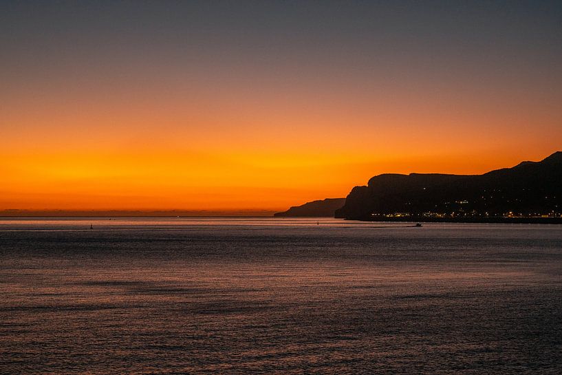 Sunset on the Sesimbra coast near Lisbon by Leo Schindzielorz