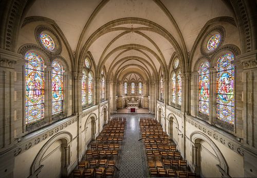 Church with stained glass windows by Inge van den Brande