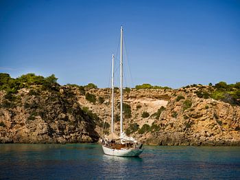 Sailing boat in idyllic Ibiza bay