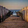 Between the poles on Domburg beach by Fotografie Jeronimo