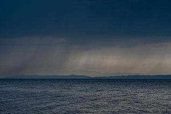 Scottish seascape on Isle of Bute with threatening rain clouds