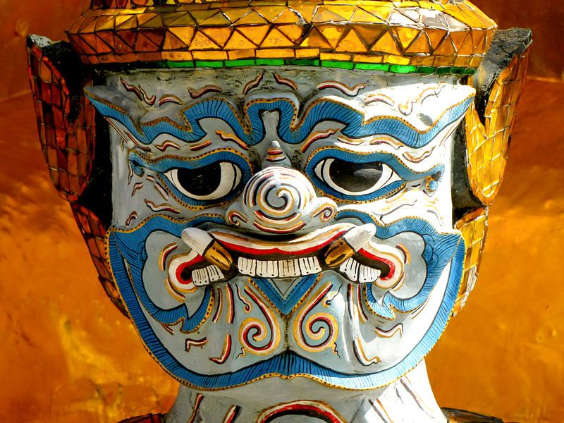 Angry looking guard at a temple in Thailand by Rietje Bulthuis