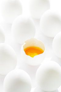 White eggs with yellow yolks in contrast
