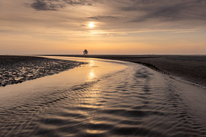 Sunset on the Engelsmanplaat in the Wadden Sea near the mudflat guard post