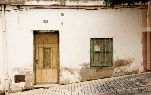 The white cottage on the hillside