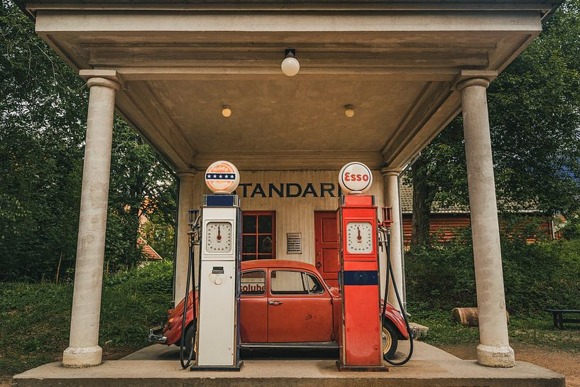 An old car parked at a petrol station by Slashley Photography