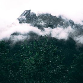 The mountains hiding in the clouds photography by Ken Tempelers