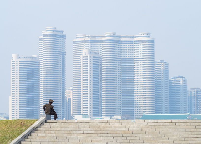 Soldier enjoys view over Pyongyang, North Korea by Teun Janssen