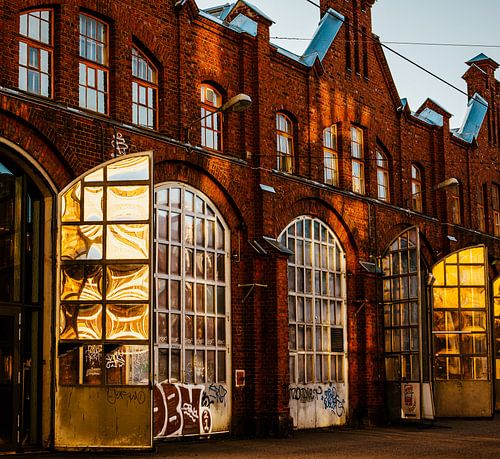 Red Brick & Golden Light – Industrial Hall with Arched Windows