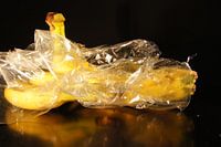 bananas with plastic packaging