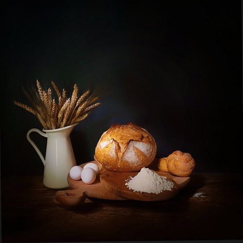 Nature morte avec du pain, des œufs, du blé.