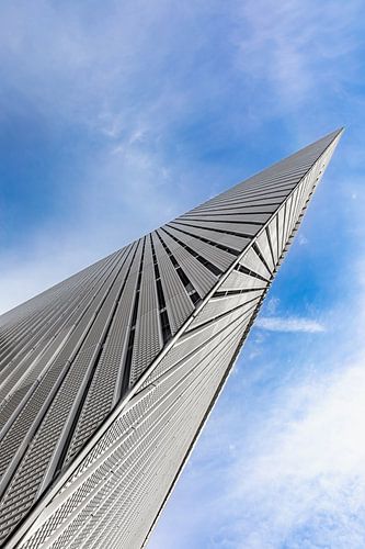 Metal wedge rises into the blue sky by Tilo Grellmann