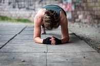 Active 36 year old white woman planking under a bridge outdoors, by Werner Lerooy thumbnail