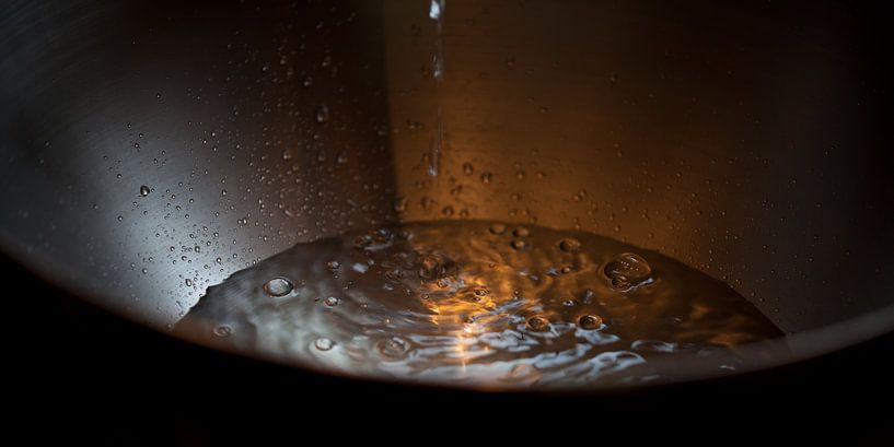 Water drops in a stainless steel bowl by t.ART