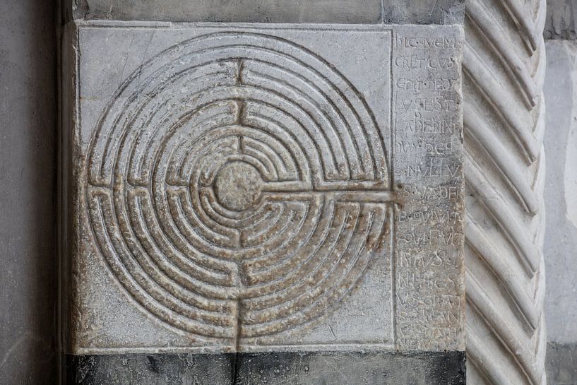 Labyrinth in the portal of the Cathedral of Lucca, Tuscany, Italy by Joost Adriaanse