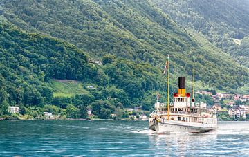 La Suisse steamboat sails from Saint Gingolph port (Switzerland), by the Leman lake.
