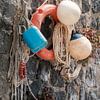 Lifebuoy, buoys and ropes in the harbour of Marina di Corricella, Procida by Melissa Peltenburg