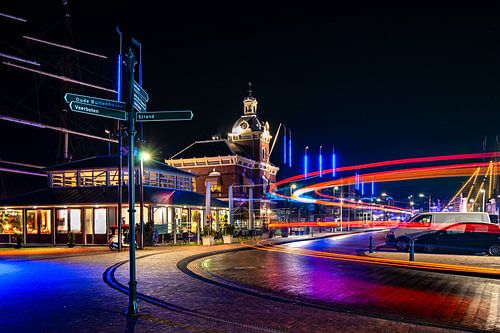 Beautifully illuminated old town hall in the center of an old port