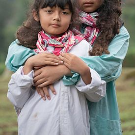 Portrait of two girls with felted hair on the Dieng Plateau by Anges van der Logt