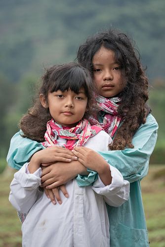 Portrait of two girls with felted hair on the Dieng Plateau by Anges van der Logt