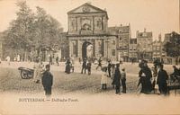 Old black and white postcard of the Delftsche Poort in Rotterdam