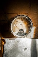 Vintage Voltage Gauge in an Abandoned Workshop
