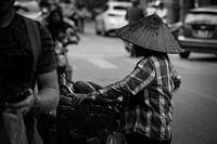 Vendor with non la in Hanoi, Vietnam