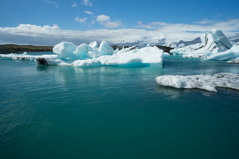 Iceland - Clear blue water of glacial lake covered by ice by adventure-photos