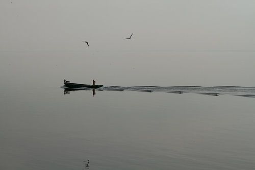 Silhouet van een visser