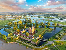 Aerial view of a flooded landscape near Loevestein Castle near Gorinchem in the Netherlands at sunset by Eye on You