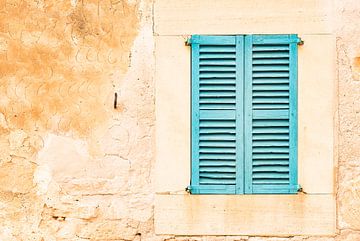 Detail view of wooden window shutters and wall by Alex Winter