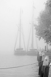 Historic sailing ships in the mist by Huub Keulers