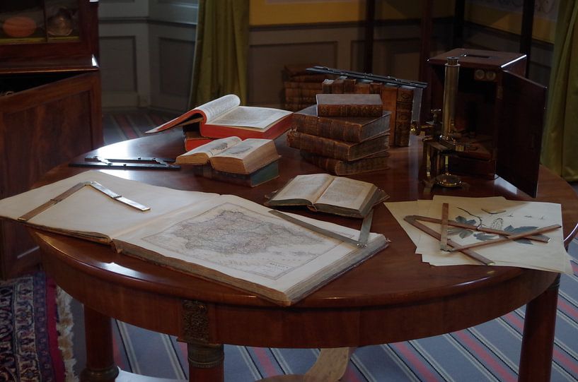 Antique table with writing utensils by Richard Pruim