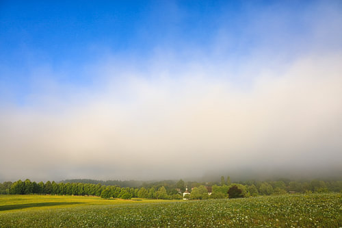 Summer landscape at the Dauenberg estate, featuring a chapel and mist lifting – Eigeltingen in the Hegau region – Constance district