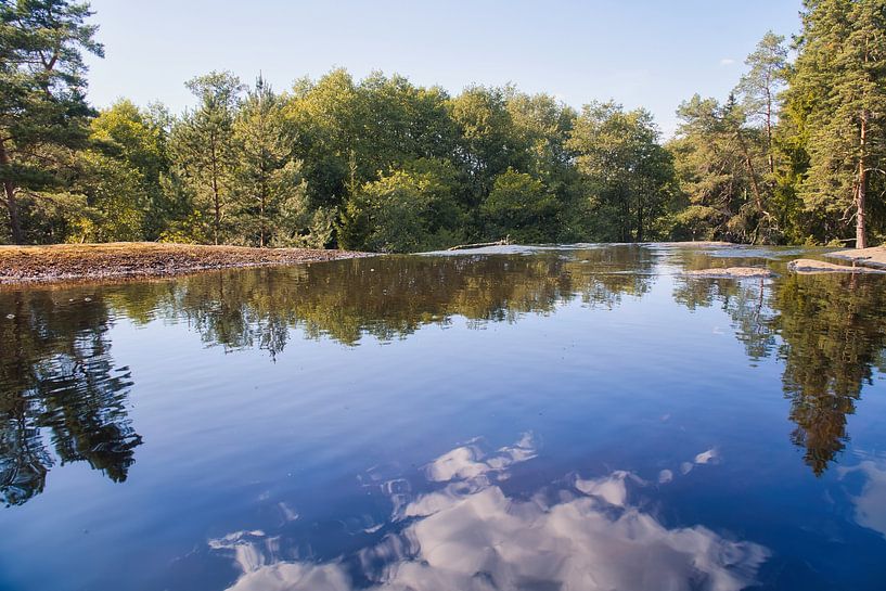 Idyllic lake in Sweden, with tree and cloud reflections in a clear natural setting by Martin Köbsch