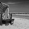 Beach chair in the sunset (black and white) by Frank Herrmann