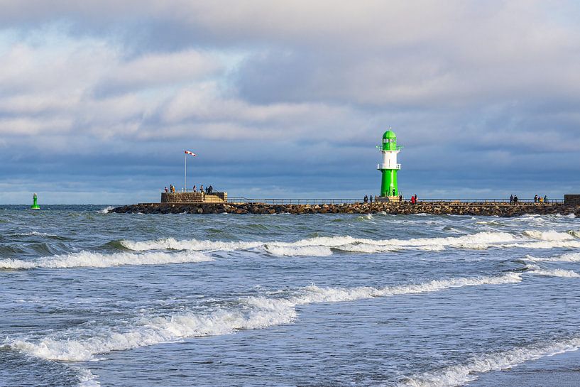 Waves, pier and pier tower on the Baltic coast in Warnemünde by Rico Ködder