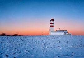 Alnes lighthouse during sunset in winter, Godøy, Norway by qtx