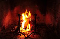 Classical fireplace with burning log