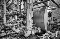 an old boiler house of a complex with horticultural greenhouses with shut-off valves and pipes with 