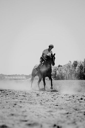 Racehorse running in black and white